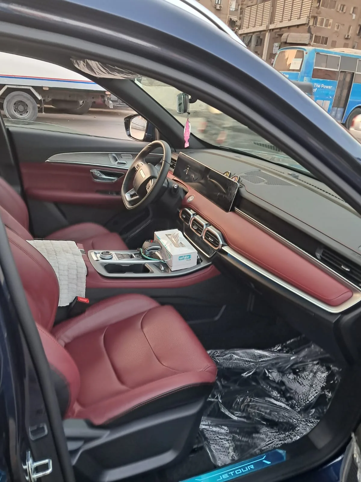 Seating and dashboard inside a JETOUR car.